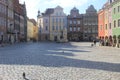 Sunny day in the old town in Poznan, Poland - colorful houses surrounding the main square